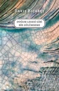 Doğum Lekesi Gibi Bir Gülümseme - İletişim Yayınevi
